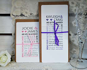 Hannah Wedding invtiation and RSVP. A contemporary design that uses text in a variety of colours and fonts to create the design. A vellum belly band and satin bow wrap around the invitation and RSVP