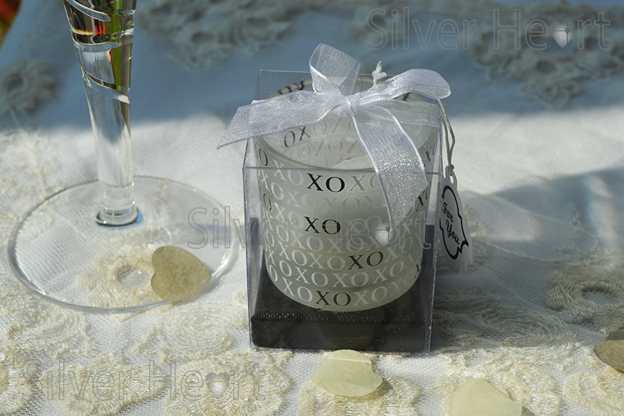 Hugs and Kisses candle wedding favour with organza ribbon and 'for you' tag in a clear display box with black stand, 5.5x5.5cm. 